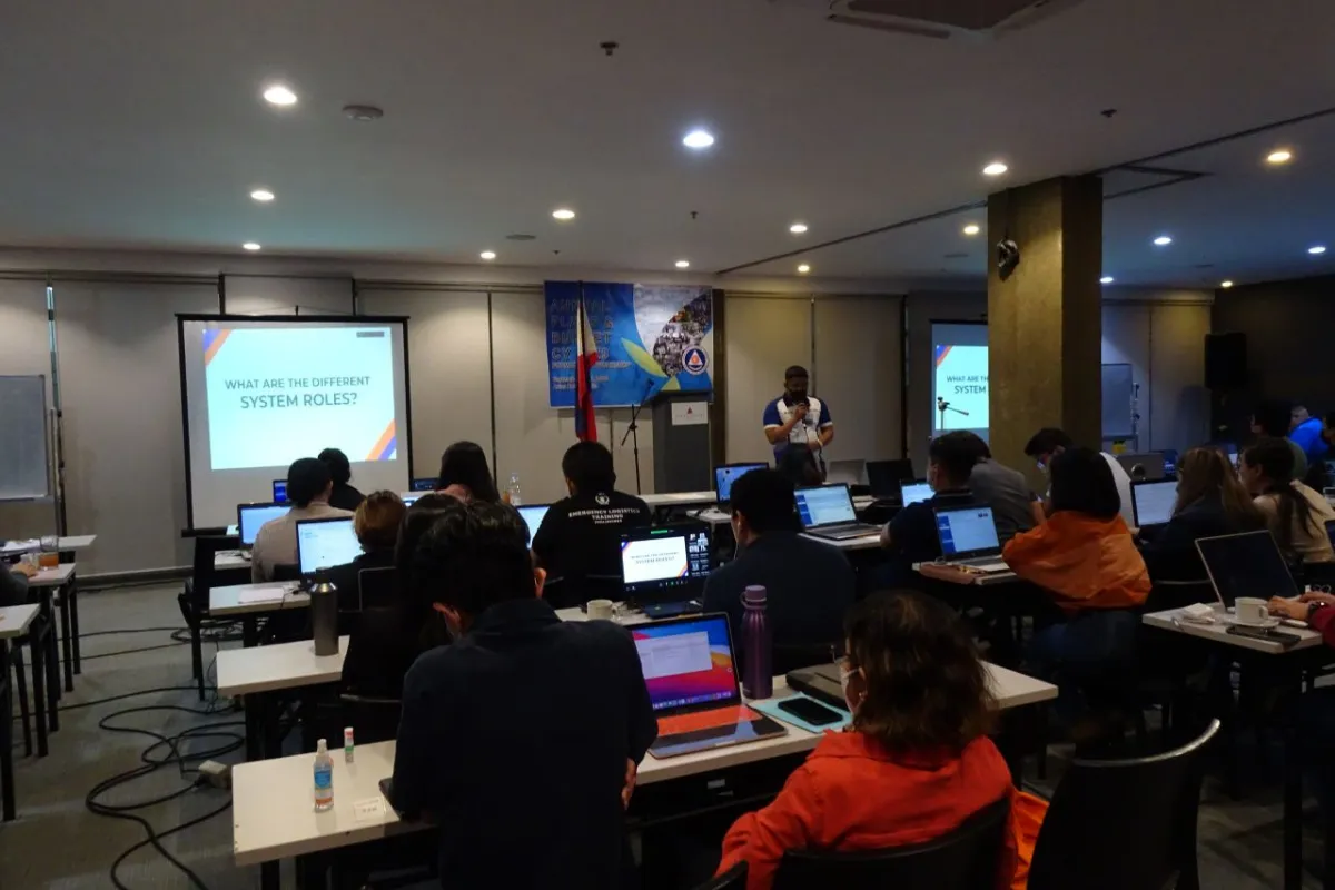Resource speaker presenting PBMIS to workshop participants